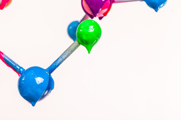 close up color of atom in heart shape are dripping. construction of molecular in heart shape...