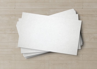 White business card stack on wooden desk 3D rendering