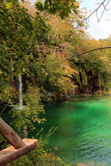 Plitvice Lakes National Park - turquoise water in a lake and vegetation of early autumn