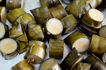Glutinous rice steamed in banana leaf.