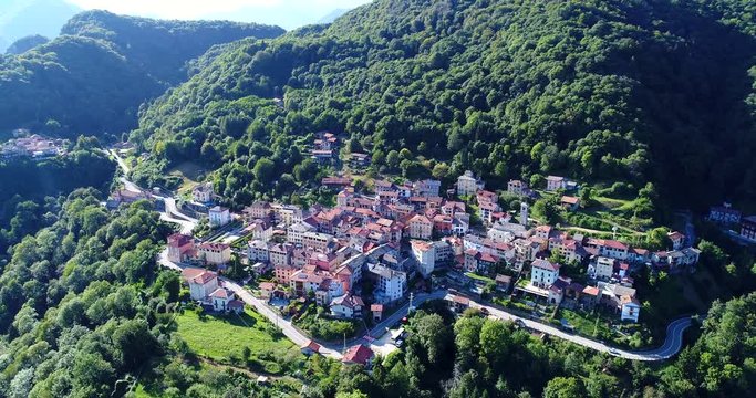 Aerial view of Civiasco village and its woods. This quaint village is located in Valsesia, Italian Alps, in the Piedmont region, northern Italy.