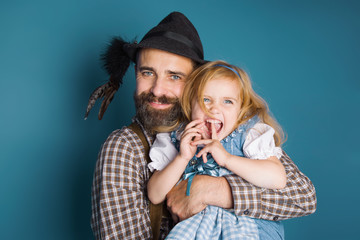 Father holding little daughter in his hands, oktoberfest - 222276647