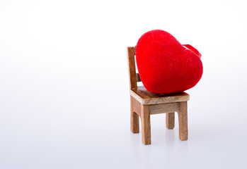 Little red color heart shape on a chair