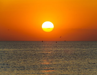 baltic seaside with red sun goes down