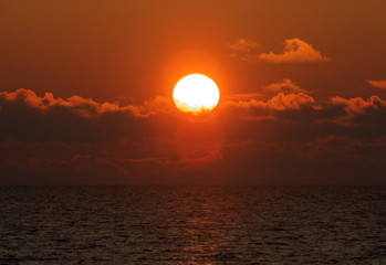 baltic seaside with red sun goes down