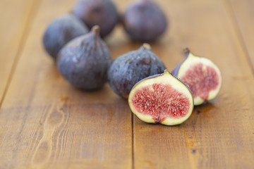 Ripe figs on a wooden table, close-up. Fresh fruit - figs.