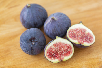 Ripe figs on a wooden table, close-up. Fresh fruit - figs.