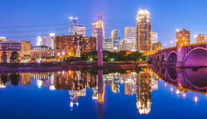  Minneapolis skyline with reflection in river at night.