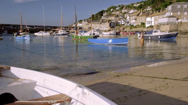 Small boats in harbour of Mousehole in Cornwall