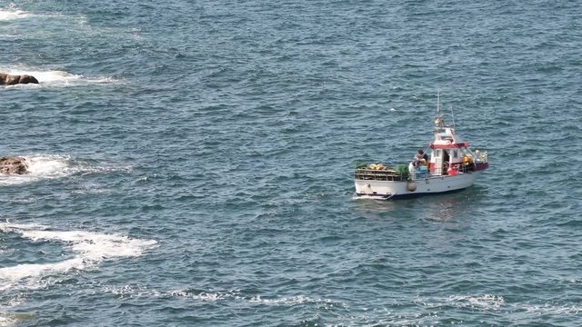 fishing boat in the sea off the coast of galicia, spain