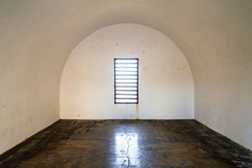 Empty room with a round ceiling and a window in Fort San Cristobal in San Juan, Puerto Rico