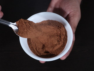Cinnamon, Cinnamon on White Bowl, Cinnamon on White bowl on Wooden Background,Cinnamon Bowl in hand