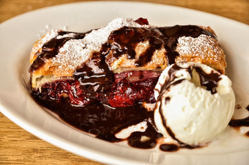 cherry strudel with chocolate and ice cream