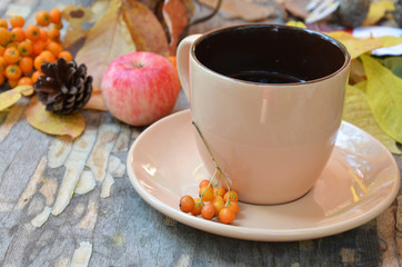 Workspace with golden leaves, notebook, coffee cup. Stylish office desk. Autumn or Winter concept. Flat lay, top view.