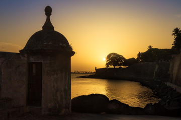 Beautiful summer sunset at the outer wall with sentry box of fort San Felipe del Morro in old San Juan in Puerto Rico