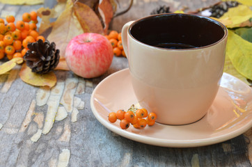 Workspace with golden leaves, notebook, coffee cup. Stylish office desk. Autumn or Winter concept. Flat lay, top view.