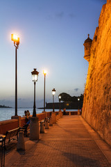 Promenade at the outer wall of old San Juan, Puerto Rico, at dusk

