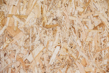 Wood particle board surface close-up background
