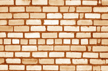 Orange tone old grungy brick wall surface.