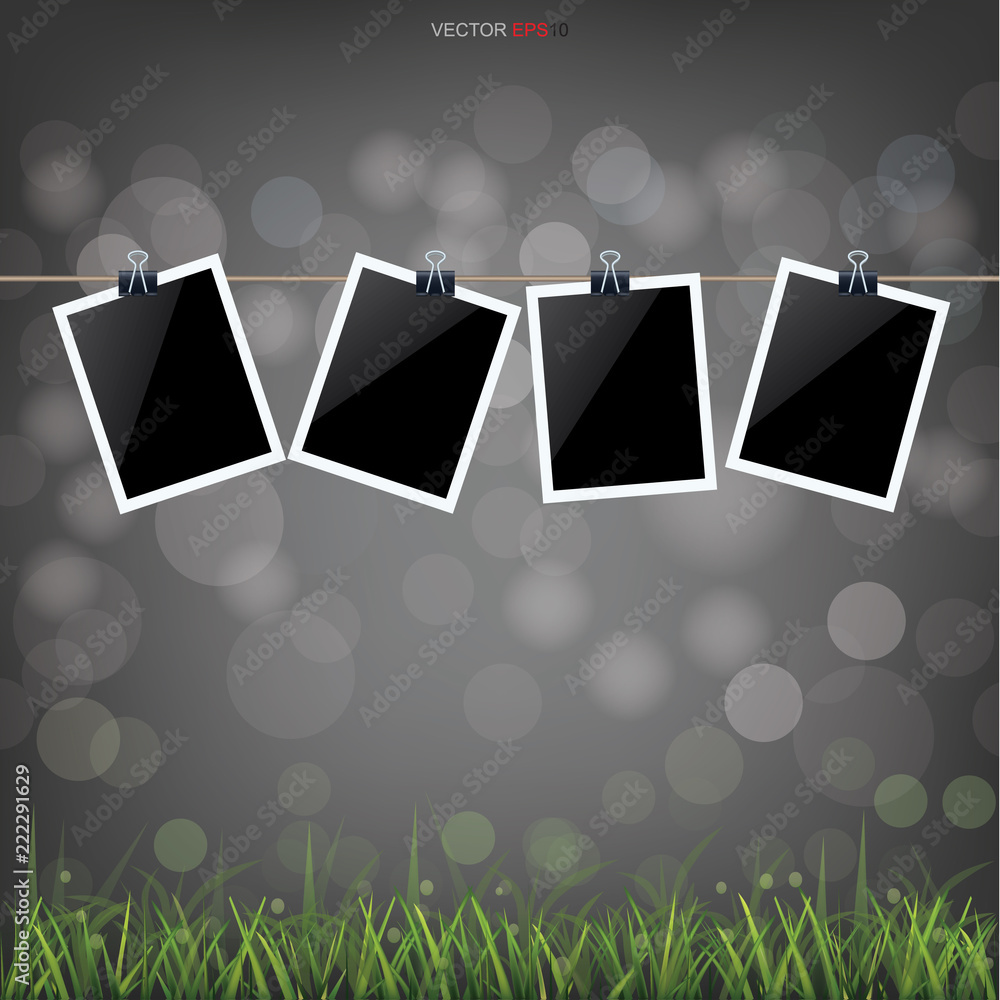 Aufkleber blank photo frame in grass field with light blurred bokeh background. vector.