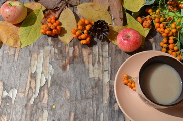Workspace with golden leaves, notebook, coffee cup. Stylish office desk. Autumn or Winter concept. Flat lay, top view.