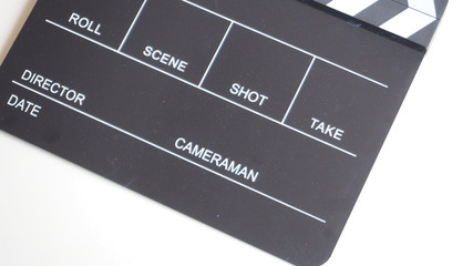 Black Clapperboard or clap board or movie slate use in video production , movie, cinema industry on white background .