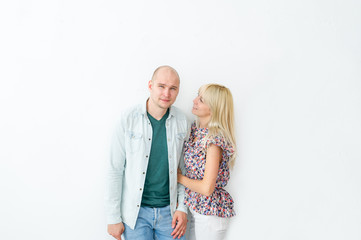 Obraz na płótnie Canvas Portrait of happy couple standing on white background