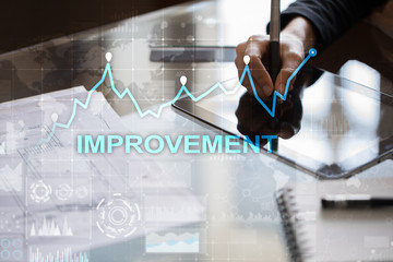 Improvement graph on virtual screen. Business and technology concept.?