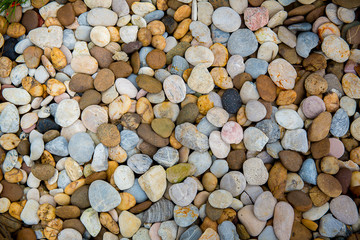 Sea pebbles. Small stones gravel texture background.Pile of pebbles, thailand.Color stone in background.