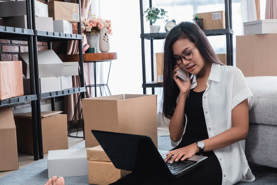pretty asian woman receiving online order