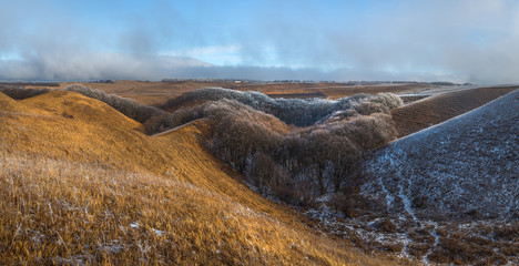 Orange steppe in the snow, hoarfrost. The winter steppe is frostbitten. Steppe landscape, nature.