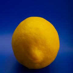 big yellow lemon on a blue background.