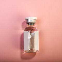 bottle with medical injection on a pink background. Web banner.