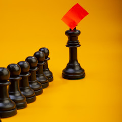 Chess Pieces Pawn and Queen on a Yellow Background. Web Banner.