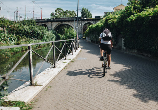 Milan ITALY - July 2018 biker along the Martesana canal in Milan.