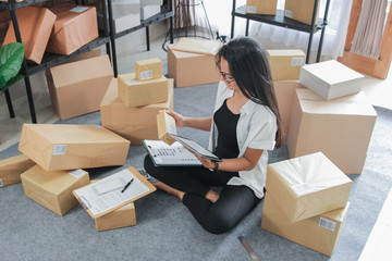 Portrait young woman with online business working at home