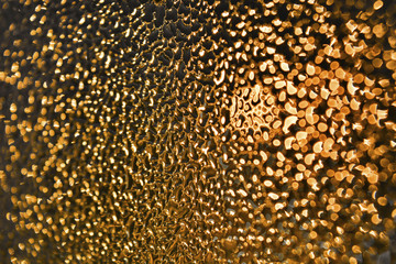 abstract background Golden drops on black glass