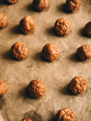 Hot prepared meat balls on baking sheet with paper