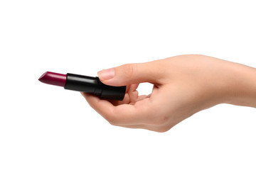 Lipstick in woman hand isolated on white.