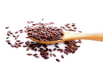 Flax seeds in wood spoon on white background