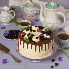 Festive table, big cake, beautiful tableware, tea