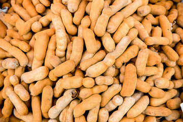 Pile of ripe Tamarind fruits.Sweet ripe tamarinds. Tamarind fruit Background. A big pile of tamarinds use for background or wallpaper.