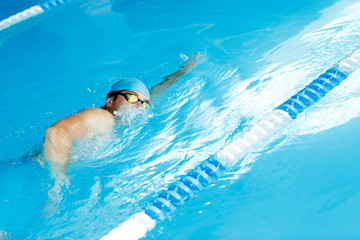 Freestyle swimmer in swimming pool