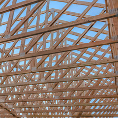 Close up of wood beams of roof top looking up