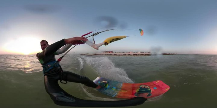 A man on a kitesurf ride on the sea, shooting 360 degrees