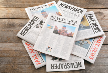 Newspapers on wooden background