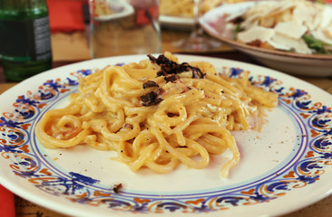 traditional italian dish - spaghetti carbonara with bacon and cream sauce 