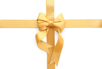 Fototapeta premium Golden ribbons with bow on white background