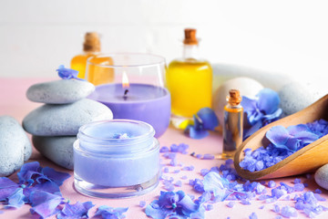 Spa composition with hydrangea flowers and sea salt on color table