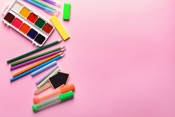 Set of school stationery on color background